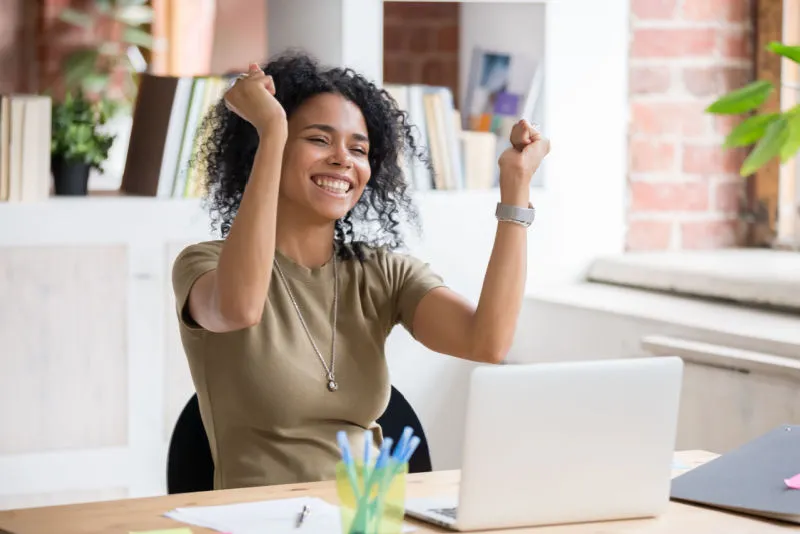 Woman smiling at desk